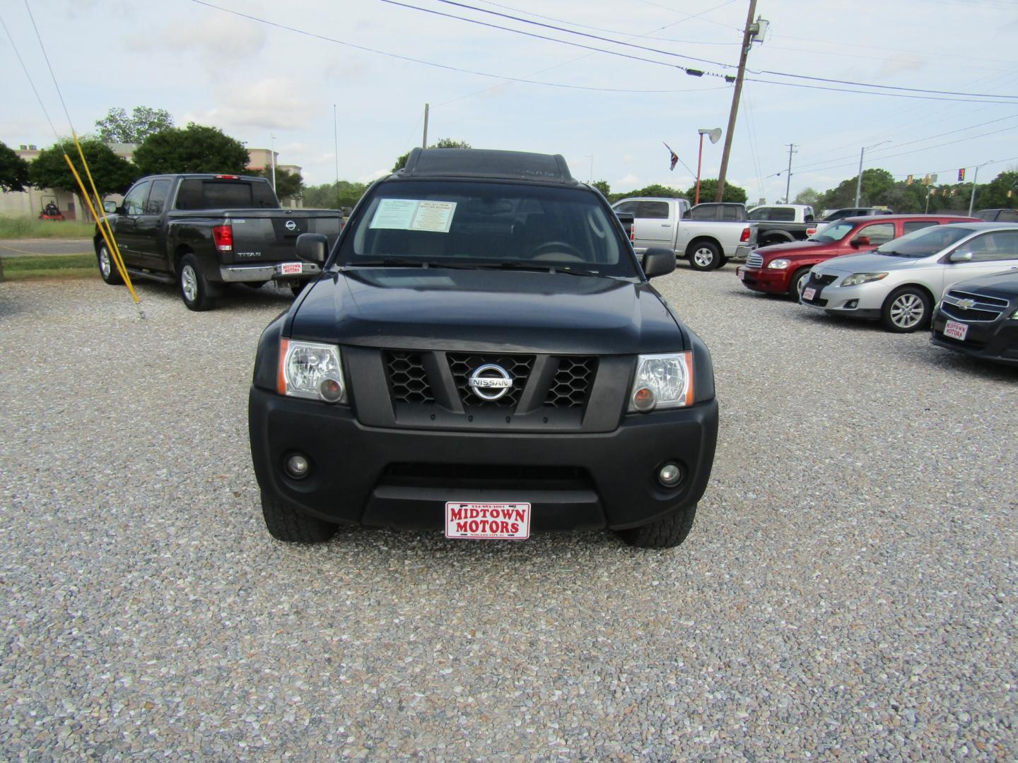 2005 Black /BROWN/TAN Nissan Xterra (5N1AN08U85C) with an 6 Cyl engine, Automatic transmission, located at 15016 S Hwy 231, Midland City, AL, 36350, (334) 983-3001, 31.306210, -85.495277 - Photo#1